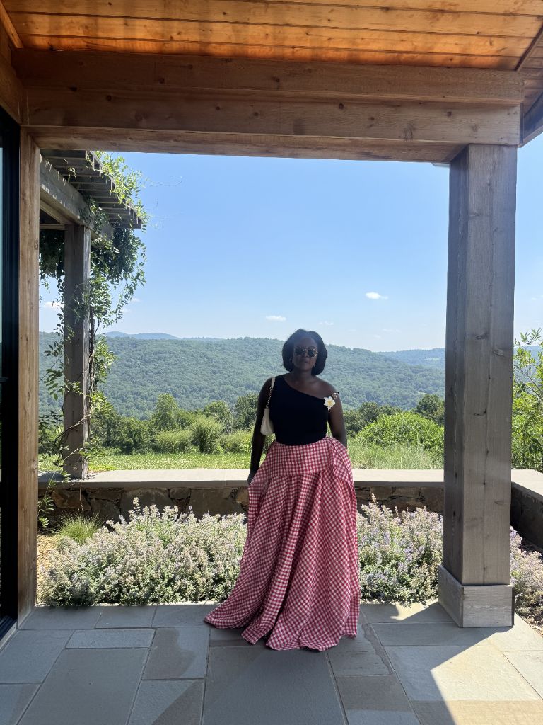 A flowing red-gingham circle skirt, made by hand, on a porch in Maryland